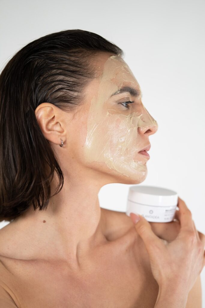 a woman with a facial mask on her face